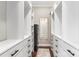 Spacious walk-in closet with custom shelving and drawers, offering ample storage space and a mirror for convenience at 215 S Shaver St, Salisbury, NC 28144