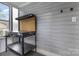 The interior features a workbench with pegboard, and natural light adding a functional workspace to the property at 215 S Shaver St, Salisbury, NC 28144
