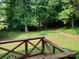 A lush, green backyard, as seen from a wooden deck with a railing at 2222 Raven Dr, Rock Hill, SC 29732