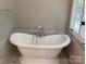 Bathroom showcasing a classic clawfoot tub near a large window at 2222 Raven Dr, Rock Hill, SC 29732