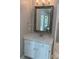 Bathroom vanity with white cabinets, marble countertops, modern faucets, and mirror at 2222 Raven Dr, Rock Hill, SC 29732