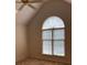 Cozy bedroom featuring a vaulted ceiling, neutral carpeting, and a large window at 2222 Raven Dr, Rock Hill, SC 29732