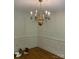 Elegant dining room showcasing decorative chandelier and wainscoting, ideal for formal gatherings at 2222 Raven Dr, Rock Hill, SC 29732