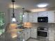 Bright kitchen with stainless steel appliances, granite countertops, and white cabinets at 2222 Raven Dr, Rock Hill, SC 29732