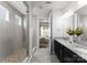 Modern bathroom showcasing dual vanities, a large shower, and access to the primary bedroom at 2236 Prairie Rd, Concord, NC 28027