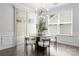 Cozy dining area with modern light fixture, hardwood floors, and lots of natural light at 2236 Prairie Rd, Concord, NC 28027