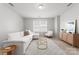 Inviting living room with a comfortable sofa, modern furniture, and a large window at 2236 Prairie Rd, Concord, NC 28027