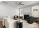 Relaxing living room featuring a fireplace, lots of natural light and soft accents at 2236 Prairie Rd, Concord, NC 28027