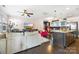 Open-concept living room and kitchen with hardwood floors and stylish furnishings at 2313 Blueberry St, Belmont, NC 28012