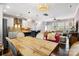 Open-concept living space featuring a modern kitchen, dining area, and comfortable seating with an abundance of natural light at 2313 Blueberry St, Belmont, NC 28012