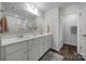 Modern bathroom with a double vanity, large mirror, and sleek fixtures for a contemporary feel at 240 Briana Marie Way, Indian Trail, NC 28079