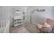 Charming Bedroom with soft pink accents, a cozy rocking chair, and ample storage for a growing Gathering at 240 Briana Marie Way, Indian Trail, NC 28079