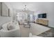 Inviting living room with neutral color scheme, stylish furnishings, and a modern chandelier at 240 Briana Marie Way, Indian Trail, NC 28079
