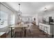 Bright and airy living space featuring an open floorplan with dining and kitchen areas at 240 Briana Marie Way, Indian Trail, NC 28079