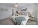 Bright and airy bedroom with a comfortable bed, stylish decor, and ample natural light at 240 Briana Marie Way, Indian Trail, NC 28079