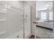 Clean shower with glass door and built-in shelves, conveniently located near the Primary bedroom at 240 Briana Marie Way, Indian Trail, NC 28079