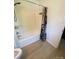 Bathroom featuring a shower and tub combination and modern flooring at 2412 Elizabeth Ave, Staley, NC 28150