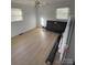 Bright bedroom features wood-look floors, a ceiling fan, and natural light from two windows at 2412 Elizabeth Ave, Staley, NC 28150
