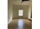 Bright bedroom with laminate flooring and large window at 2412 Elizabeth Ave, Staley, NC 28150