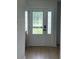 Bright entryway with laminate flooring, large front door, and natural light at 2412 Elizabeth Ave, Staley, NC 28150