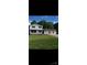 Charming two-story home with landscaped yard and white siding at 2412 Elizabeth Ave, Staley, NC 28150