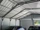 Spacious garage interior featuring steel beams, siding and ample room for storage or vehicles at 2412 Elizabeth Ave, Staley, NC 28150