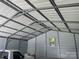 Spacious garage interior featuring steel beams, siding and ample room for storage or vehicles at 2412 Elizabeth Ave, Staley, NC 28150