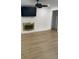 Modern living room featuring brick fireplace, ceiling fan, and neutral-toned flooring at 2412 Elizabeth Ave, Staley, NC 28150
