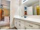 Bright bathroom featuring a white vanity with a tile countertop and view to bedroom at 2434 Olewoods Ct, Rock Hill, SC 29732