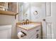 A half bathroom showcasing a white vanity with granite counters and stylish fixtures at 2434 Olewoods Ct, Rock Hill, SC 29732