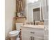 Half bathroom features a granite countertop, white vanity, and rustic-chic decor at 2434 Olewoods Ct, Rock Hill, SC 29732