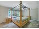 Bedroom featuring a decorative four-poster bed, neutral walls, and carpet at 2434 Olewoods Ct, Rock Hill, SC 29732
