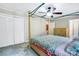 Bedroom featuring a canopy bed, neutral walls, and a double-door closet for storage at 2434 Olewoods Ct, Rock Hill, SC 29732