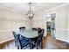 Dining room with modern lighting, flows into kitchen, and features sleek flooring at 2434 Olewoods Ct, Rock Hill, SC 29732