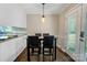 Dining area close to the kitchen has modern flooring, lighting and outdoor access at 2434 Olewoods Ct, Rock Hill, SC 29732