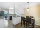 Bright kitchen features modern bar seating, granite counters, and stainless steel appliances at 2434 Olewoods Ct, Rock Hill, SC 29732