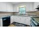 Bright kitchen with white cabinets, granite counters, and stainless steel appliances at 2434 Olewoods Ct, Rock Hill, SC 29732