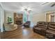 Relaxing living room area with a fireplace, plush seating, and laminate flooring at 2434 Olewoods Ct, Rock Hill, SC 29732