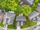 Aerial shot of a home with a wooden deck and landscaped backyard and surrounding neighborhood at 2563 Firethorn Ct, Gastonia, NC 28056