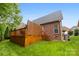 Well-maintained backyard with a wooden deck and lush lawn at 2563 Firethorn Ct, Gastonia, NC 28056