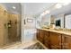 Bright bathroom boasts double sinks, garden tub, tiled shower and walk-in closet at 2563 Firethorn Ct, Gastonia, NC 28056