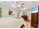 Elegant bedroom features a tray ceiling, ceiling fan, and neutral paint at 2563 Firethorn Ct, Gastonia, NC 28056