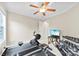 Spacious exercise room with television, work out equipment and a ceiling fan at 2563 Firethorn Ct, Gastonia, NC 28056