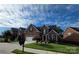 Charming two-story brick home with an attached two car garage and a well-manicured lawn at 2563 Firethorn Ct, Gastonia, NC 28056