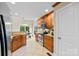 Well-equipped kitchen with wooden cabinetry and easy access to the dining area at 2563 Firethorn Ct, Gastonia, NC 28056