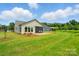 Green backyard featuring a brick paver patio, a screened in porch, and mature lawn at 258 Cherrytree Dr, Fort Mill, SC 29715