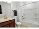 Bright bathroom featuring a single sink vanity, a toilet, and a shower-tub combination at 258 Cherrytree Dr, Fort Mill, SC 29715