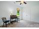 Cozy bedroom with neutral carpet, ceiling fan, a charming desk and a lovely view at 258 Cherrytree Dr, Fort Mill, SC 29715