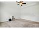 Spacious bedroom features neutral carpet, a ceiling fan, and ample natural light at 258 Cherrytree Dr, Fort Mill, SC 29715