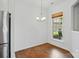 Bright dining area with a window offering natural light and hardwood floors adjacent to the kitchen at 258 Cherrytree Dr, Fort Mill, SC 29715